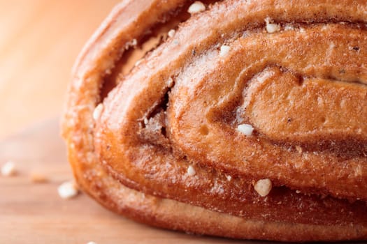 Korvapuusti, traditional finnish cinnamon and cardamom rolls, close-up of fresh baked bun, sweet dessert Sweden and Finland