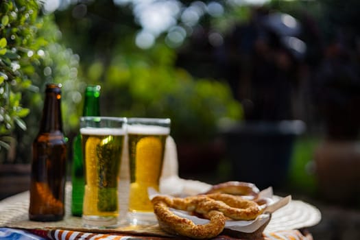 Glasses of cold beer and pretzels. Oktoberfest celebration.