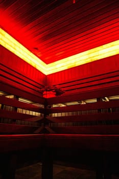 Modern sauna with red lighting and wooden walls