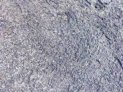 Gravel texture seen at a construction site under bright daylight.