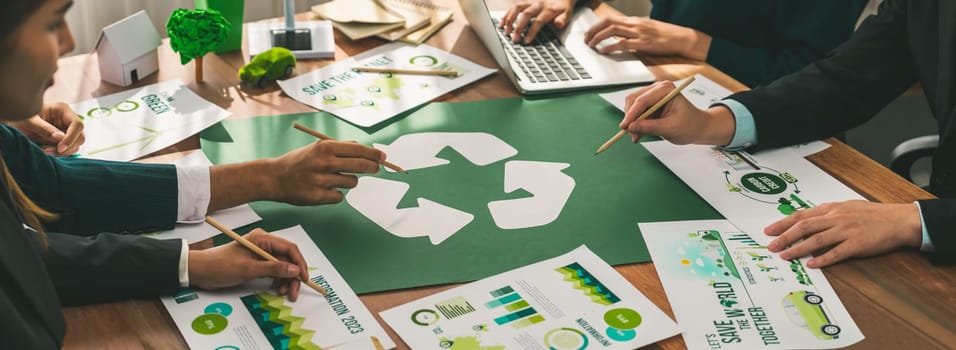 Group of business people planning and discussing on recycle reduce reuse policy symbol in office meeting room. Green business company with eco-friendly waste management regulation concept.Trailblazing