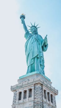 The Statue of Liberty, New York City on sunny blue sky. American symbol. Memorial day, Patriot Day. Space for text. New York NY USA 2023-07-30.