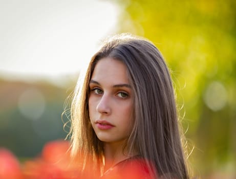 Portrait of a beautiful girl in an autumn park