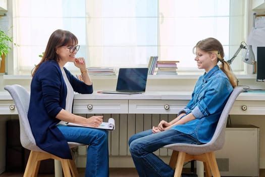Pre-teen girl at therapy meeting with child psychologist therapist. Mental health of children, problems of adolescence, professional help support from specialist counselor psychotherapist