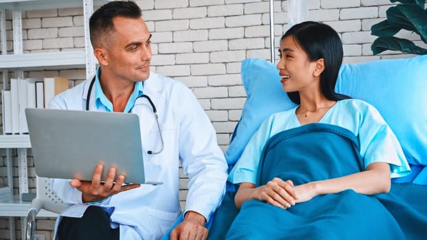 Doctor in professional uniform examining patient at hospital or medical clinic. Health care , medical and doctor staff service concept. Jivy