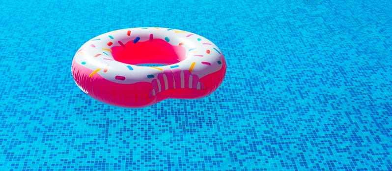 Vibrant inflatable ring showcasing a delicious doughnut design beckons for pool playtime