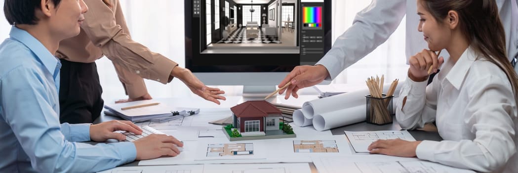 Group of interior architect designer discussing together on blueprint and laptop screen display architecture software for more precise designing layout. Modern home design and renovation. Insight