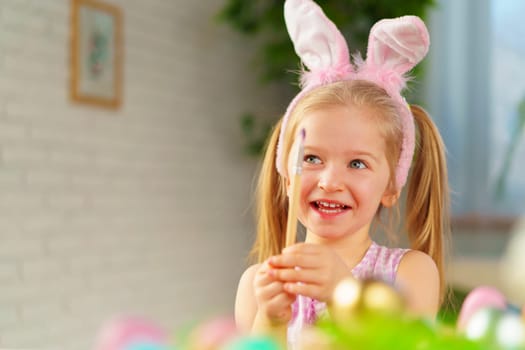 Portrait of a cute toddler girl with bunny ears