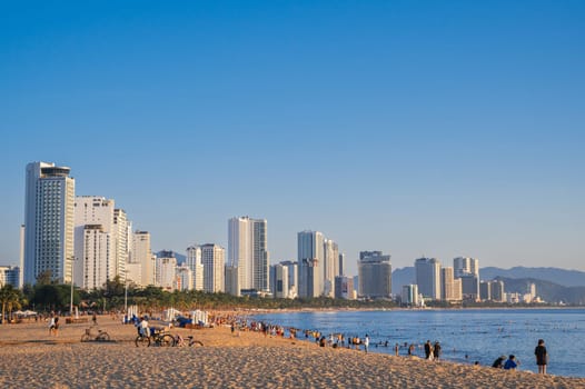 Sandy beach by the sea in a resort town in summer in Asia. Nha Trang, Vietnam - August 3, 2024