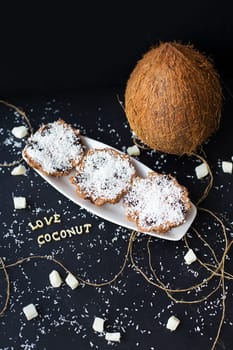 coconut muffins on a black background with words like candied fruits and coconuts