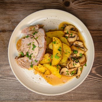 RECIPE VEAL ROAST, FRIES AND MUSHROOMS WITH SAUCE. High quality photo