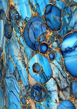A mesmerizing display of blue and gold abstract art features flowing patterns and glimmering accents. The intricate swirls create depth and visual interest, inviting closer examination.