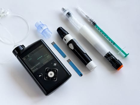 Diabetes management tools, insulin pump, pen, and syringe essentials.