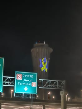 18 August 2024 Tel-Aviv Israel Ben Gurion airport , Terminal 3, control tower, a sign of solidarity with Israeli hostages held by Hamas 7 October 2023, night black sky. High quality photo