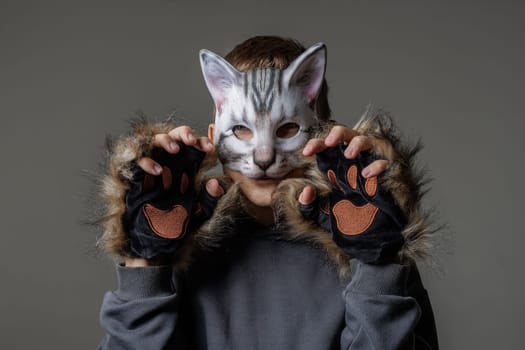 portrait of a teenager quadrobics in a cat mask on a white background, quadrobika subculture imitation of animal actions
