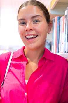 Beautiful russian teenage student laughing looking at camera outdoors. Girl sitting with happy face.