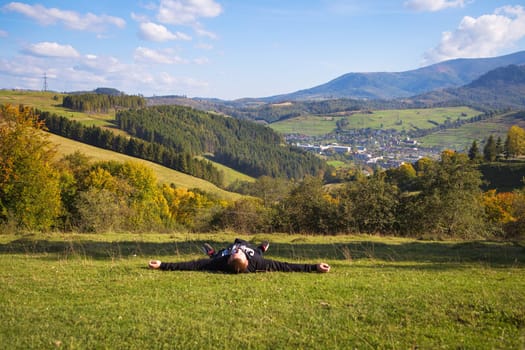 very beautiful panorama of the carpathian autumn-guy lies on the background of this panorama.
