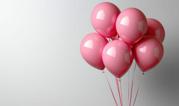 Pink greeting balloons on white background. Selective focus.