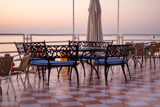 An outdoor cafe with stunning sea views, offering a perfect spot for relaxation and dining