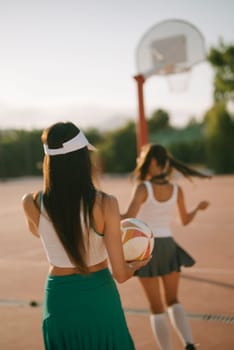 Enjoying a thrilling basketball game with friends at sunset, showcasing incredible athleticism and camaraderie
