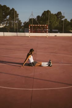 On a solitary court, a single athlete stretches, embodying the profound spirit of dedication and selfreflection