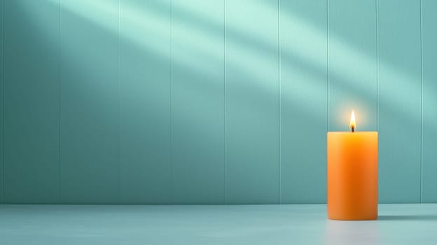 flickering orange candle casts warm glow against teal wall.
