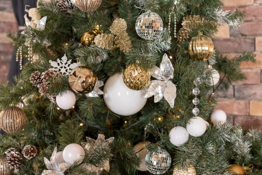 Christmas tree branches with decorations, balls, garlands, bokeh. Postcard with space for text.
