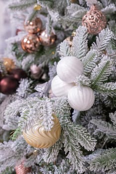 Christmas tree branches with decorations, balls, garlands, bokeh. Postcard with space for text.