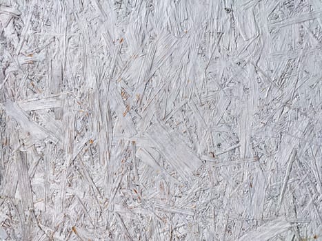 This textured background features a detailed arrangement of light grey wood fibers, perfect for creative projects and design work.