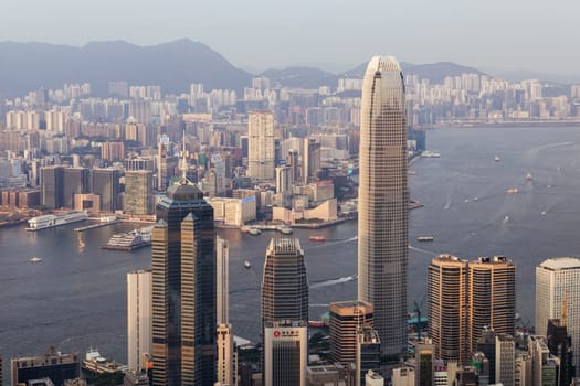 HONG KONG, CHINA - SEPTEMBER 29, 2024: Iconic view around sunset from Lugard Rd Lookout which overlooks Hong Kong Island and Kowloon in Hong Kong, China