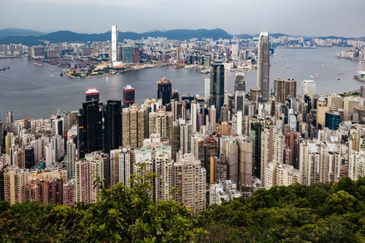 HONG KONG, CHINA - SEPTEMBER 29, 2024: Iconic view around sunset from Lugard Rd Lookout which overlooks Hong Kong Island and Kowloon in Hong Kong, China