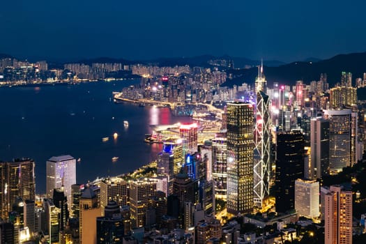 HONG KONG, CHINA - SEPTEMBER 29, 2024: Iconic view around sunset from Lugard Rd Lookout which overlooks Hong Kong Island and Kowloon in Hong Kong, China