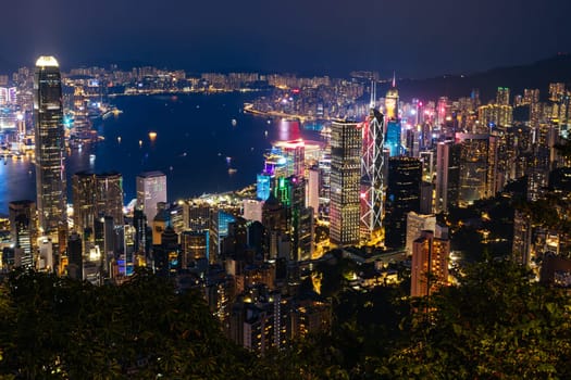 HONG KONG, CHINA - SEPTEMBER 29, 2024: Iconic view around sunset from Lugard Rd Lookout which overlooks Hong Kong Island and Kowloon in Hong Kong, China