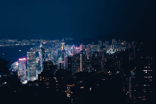HONG KONG, CHINA - SEPTEMBER 29, 2024: Iconic view around sunset from Lugard Rd Lookout which overlooks Hong Kong Island and Kowloon in Hong Kong, China