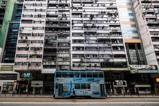 HONG KONG, CHINA - SEPTEMBER 29 2024: Streetscape with busy roads and trams in Wan Chai on Hong Kong Island in Hong Kong China