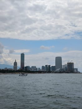 blue sea waves sky nature landscape water and white clouds. Batumi Georgia building. High quality photo