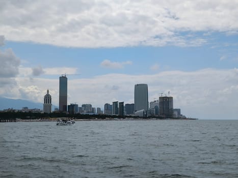 blue sea waves sky nature landscape water and white clouds. Batumi Georgia famous building beautiful evening city background. High quality photo