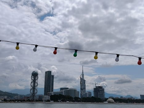 blue sea waves sky nature landscape water and white clouds. Batumi Georgia famous building beautiful evening city background. High quality photo