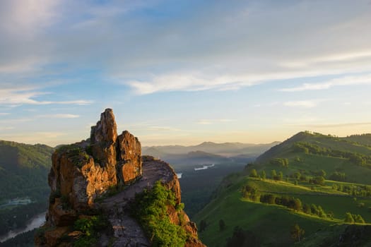 Beauty dawn on the peak, in the mountains in Altay