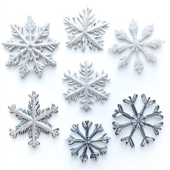 Unique snowflakes in stylish silver metallic design, on white background. New Year decorations