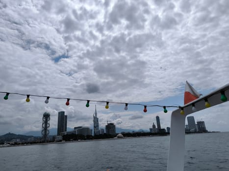 blue sea waves sky nature landscape water and white clouds. Batumi Georgia famous building beautiful evening city background. High quality photo