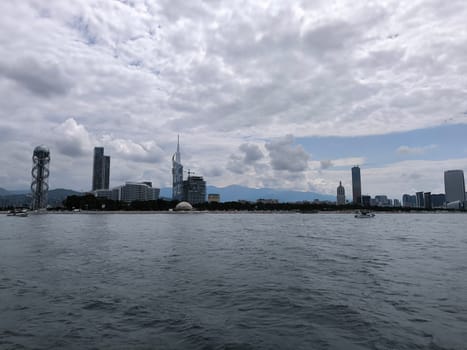 blue sea waves sky nature landscape water and white clouds. Batumi Georgia famous building beautiful evening city background. High quality photo