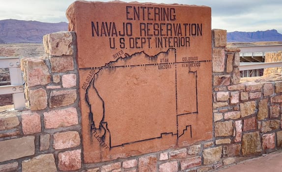Marble Canyon, Arizona, USA - 03.13.2024: A sign welcoming visitors as they enter the Navajo Reservation. The sign features a map outlining the boundaries of the reservation across the Southwest.