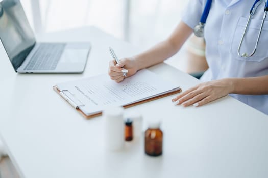 The doctor is checking the patient's history before giving treatment.