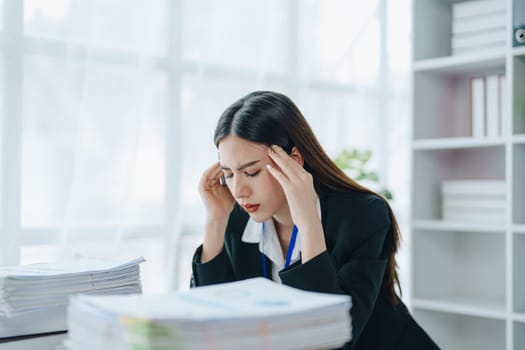 Portrait of business owner, woman using computer and financial statements Anxious expression on expanding the market to increase the ability to invest in business.