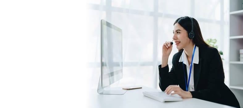 young business woman wear wireless headset video conference calling on laptop computer talk by webcam discussing in online meeting about budget and profit of company. copy space concepts.