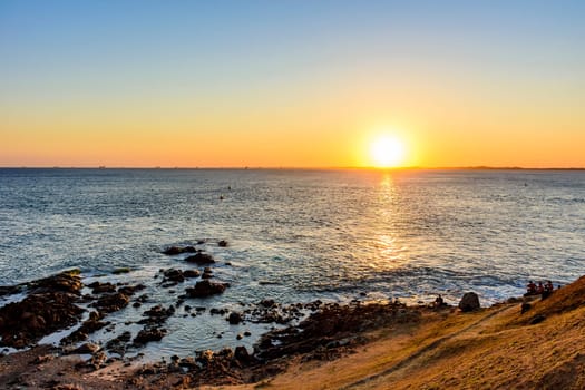 Sunset at the Barra lighthouse in the city of Salvador with a view of All Saints bay