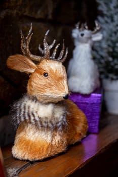 a deer toy near the festive boxes for the new year.