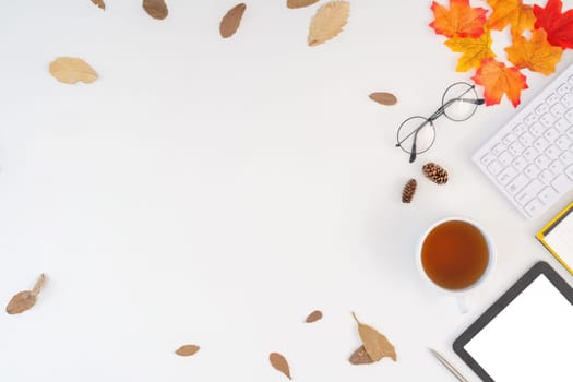 Desk workspace with blank copy space mockup, coffee cup, technology, leaves on autumn background. Top view girl business, work concept. top view freelance business concept for social media.