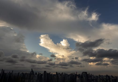 Bangkok, Thailand - 04 Aug 2024 - Beautiful Clouds in the Sky over Large Metropolitan City of Bangkok. View of Skyscrapers and Dramatic Sky before Sunset, Space for text, Selective focus.